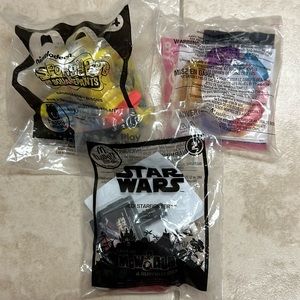 McDonald’s happy meal toys: SpongeBob, Belle’s toy bracelet, Jedi star-fighter